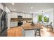 Bright kitchen with an island, modern appliances, and a dining nook at 10235 Rustic Redwood Ln, Highlands Ranch, CO 80126