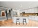 Spacious kitchen featuring stainless steel appliances and breakfast bar seating at 10235 Rustic Redwood Ln, Highlands Ranch, CO 80126