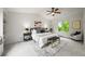 Well-lit primary bedroom with a calming color scheme, complemented by a ceiling fan and natural light at 10235 Rustic Redwood Ln, Highlands Ranch, CO 80126