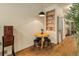 Cozy dining area featuring a round table with stools and built-in shelving at 325 E 7Th Ave, Denver, CO 80203