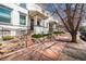 Street view of inviting two-story brick homes with well-kept lawns and sidewalk at 325 E 7Th Ave, Denver, CO 80203