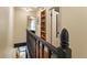 Bright hallway featuring hardwood floors, a built-in bookcase, and views into another bedroom at 325 E 7Th Ave, Denver, CO 80203