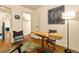 Bright home office space featuring a unique table, a comfortable chair, and a stylish floor rug at 325 E 7Th Ave, Denver, CO 80203