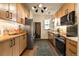 Well-designed kitchen with stainless steel refrigerator, wood countertops and contemporary lighting at 325 E 7Th Ave, Denver, CO 80203