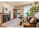 Cozy living room with a fireplace, stylish furniture, and ample natural light at 325 E 7Th Ave, Denver, CO 80203