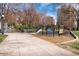 Governors' Park features playground equipment and benches along paved walkways, perfect for outdoor recreation at 325 E 7Th Ave, Denver, CO 80203