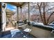 Inviting outdoor porch with seating area and view of neighborhood at 325 E 7Th Ave, Denver, CO 80203