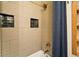 Close up of a shower with modern tiling, a rainfall showerhead, and a stylish shower curtain at 325 E 7Th Ave, Denver, CO 80203