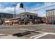 Street view of the establishment with outdoor seating, landscaping, and surrounding businesses at 325 E 7Th Ave, Denver, CO 80203