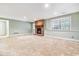 Finished basement features fireplace, carpeting and light-colored walls at 6143 E Hinsdale Ave, Centennial, CO 80112