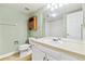 Bathroom with white vanity, large mirror and a shower with white tile surround at 6143 E Hinsdale Ave, Centennial, CO 80112