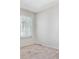 Bright bedroom with large window allowing ample natural light with neutral carpeting at 6143 E Hinsdale Ave, Centennial, CO 80112