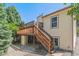 Exterior view showcasing a wooden deck with stairs, perfect for outdoor enjoyment and entertaining at 6143 E Hinsdale Ave, Centennial, CO 80112