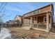 Beautifully landscaped back yard with cozy covered porch at 22870 E Chenango Ave, Aurora, CO 80015
