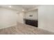 Finished basement with cabinets, countertop and hardwood style flooring at 22870 E Chenango Ave, Aurora, CO 80015