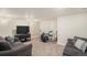 Finished basement featuring carpet and comfortable seating, ideal for entertainment or relaxation at 22870 E Chenango Ave, Aurora, CO 80015