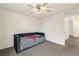 Bedroom with carpet and a ceiling fan, plus a closet for practical storage and organization at 22870 E Chenango Ave, Aurora, CO 80015