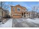 Charming two-story home with a covered porch, a two-car garage, and a well-maintained front yard at 22870 E Chenango Ave, Aurora, CO 80015