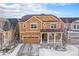 Charming two-story home featuring a two car garage, welcoming front porch and traditional architectural details at 22870 E Chenango Ave, Aurora, CO 80015