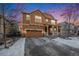 Attractive two-story home featuring a front porch, attached garage, and a well-maintained lawn at 22870 E Chenango Ave, Aurora, CO 80015