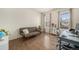 Cozy living room with hardwood floors, neutral walls, and a comfortable sofa at 22870 E Chenango Ave, Aurora, CO 80015