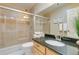 Clean bathroom with shower/tub combo and granite countertop at 25 Canongate Ln, Highlands Ranch, CO 80130