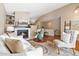 Spacious living room with hardwood floors and fireplace at 25 Canongate Ln, Highlands Ranch, CO 80130