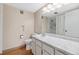 Neutral bathroom featuring wood-style flooring, white vanity and shower at 6495 E Happy Canyon Rd # 171, Denver, CO 80237