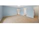 Neutral bedroom featuring a large window and door leading to a Primary closet at 6495 E Happy Canyon Rd # 171, Denver, CO 80237