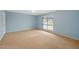 Bright bedroom offering large window and neutral carpet at 6495 E Happy Canyon Rd # 171, Denver, CO 80237