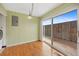 A dining area adjacent to the kitchen, featuring light green walls and hardwood floors at 6495 E Happy Canyon Rd # 171, Denver, CO 80237