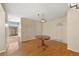 Cozy dining room features hardwood floors and an ornate chandelier, adjacent to the kitchen at 6495 E Happy Canyon Rd # 171, Denver, CO 80237