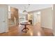 Inviting foyer with hardwood floors, exposed brick, staircase, and convenient wet bar at 6495 E Happy Canyon Rd # 171, Denver, CO 80237
