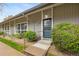 Charming home exterior featuring well-maintained landscaping and a secure front door at 6495 E Happy Canyon Rd # 171, Denver, CO 80237