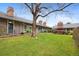 Exterior view of homes featuring grass, landscaping and brick chimney at 6495 E Happy Canyon Rd # 171, Denver, CO 80237