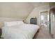 Large bedroom with king-size bed and access to a deck at 3607 Mariposa St, Denver, CO 80211