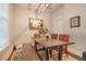 Elegant dining room featuring a rustic wooden table and bench at 3607 Mariposa St, Denver, CO 80211