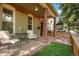 Relaxing front porch with seating area and artificial turf at 3607 Mariposa St, Denver, CO 80211