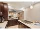 Modern kitchen with stainless steel appliances and breakfast bar at 3607 Mariposa St, Denver, CO 80211