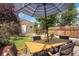 Backyard patio with dining set under umbrella at 3607 Mariposa St, Denver, CO 80211