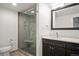 Contemporary bathroom featuring a tiled shower with a built-in bench and modern fixtures at 7865 E Mississippi Ave # 608, Denver, CO 80247