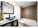 Stylish bathroom featuring a vessel sink, tiled shower/tub, and contemporary finishes at 7865 E Mississippi Ave # 608, Denver, CO 80247