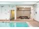 Indoor pool with ladders, and access to a spa at 7865 E Mississippi Ave # 608, Denver, CO 80247