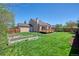 The home's backyard is spacious with a lush lawn and garden area at 714 Sedge Way, Lafayette, CO 80026