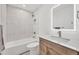 Bright bathroom with tub and shower combination, lighted mirror over single sink vanity at 714 Sedge Way, Lafayette, CO 80026