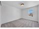 Serene bedroom with neutral carpet, a window, and light walls, offering a peaceful retreat at 714 Sedge Way, Lafayette, CO 80026