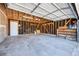 View of unfinished attached garage featuring bare studs, and concrete flooring at 714 Sedge Way, Lafayette, CO 80026