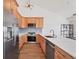 Contemporary kitchen featuring stainless steel appliances, light wood cabinets, and sleek countertops at 714 Sedge Way, Lafayette, CO 80026