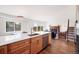 Open kitchen with light wood cabinets, stainless steel appliances, and view to living space at 714 Sedge Way, Lafayette, CO 80026