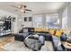 Bright and airy living room featuring a comfortable sectional sofa at 2095 S Knox Ct, Denver, CO 80219